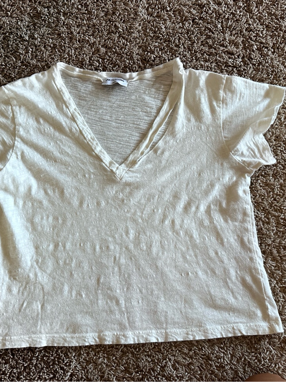 LNA Cream V-Neck Short Sleeve Tee with cut out accent.
